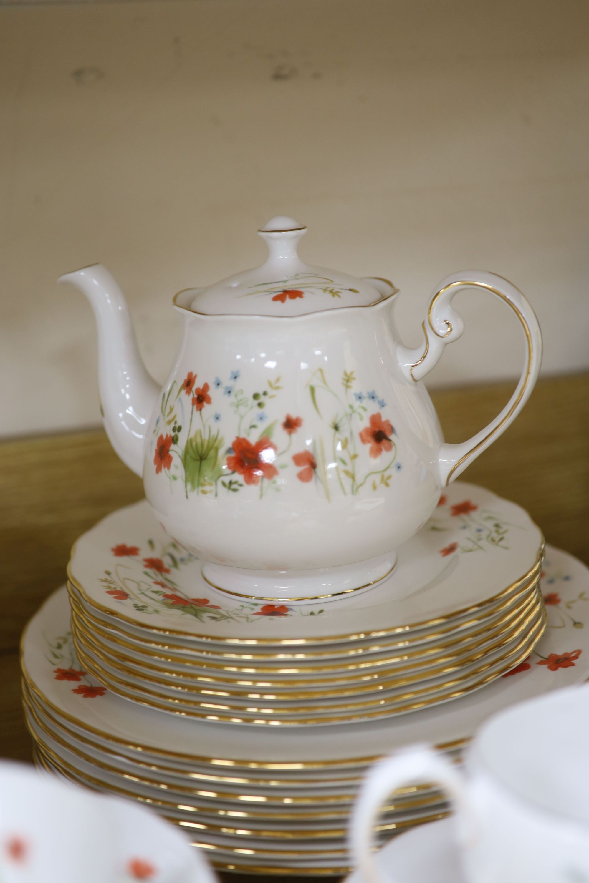 A Colclough floral decorated fifty nine piece part tea service